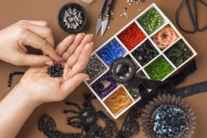 person doing beadwork